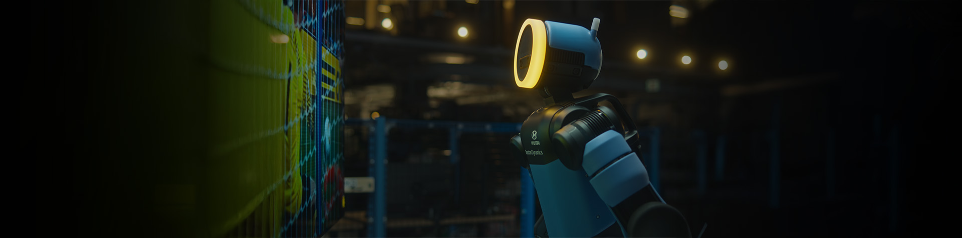 Key visual for the 'School of Football' campaign by Hyundai and Boston Dynamics, featuring a humanoid robot striking a dynamic kick pose inside an indoor laboratory.