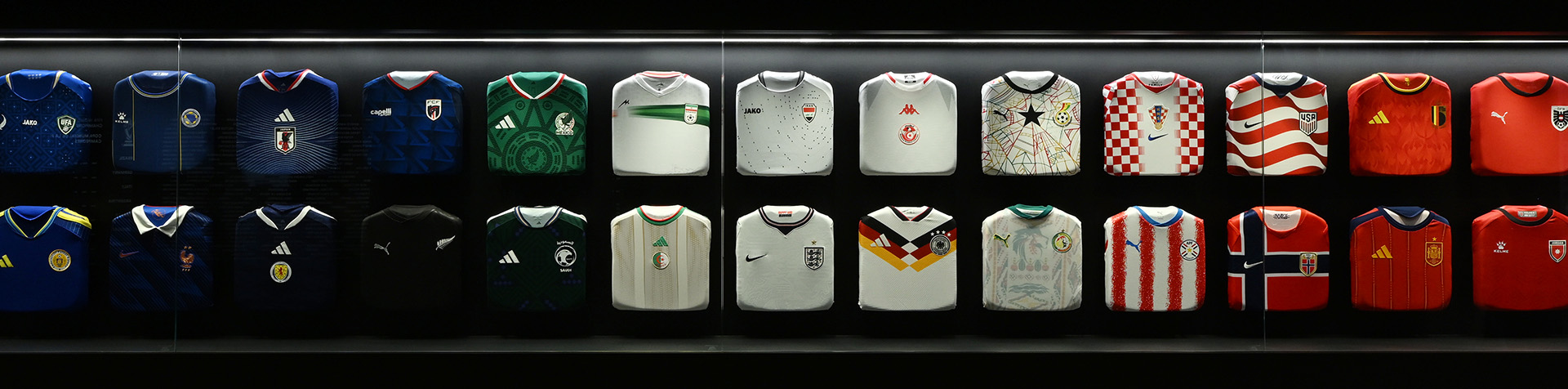 Promotional image of the FIFA Museum Presented by Hyundai’s “Legacies of Champions” exhibition, featuring jerseys from all 48 national teams participating in the FIFA World Cup 2026™.
