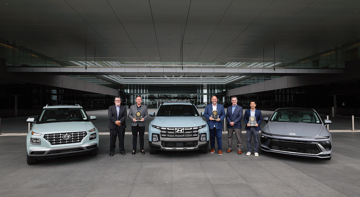 JD Power’s David Sargent, vice president and Robert Mansfield vice president, global automotive present JD Power 2026 U.S. IQS trophies to Barry Ratzlaff, chief customer officer, Natha
