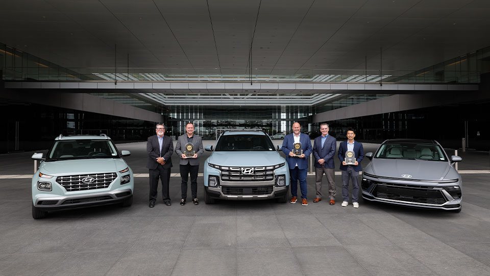 JD Power’s David Sargent, vice president and Robert Mansfield vice president, global automotive present JD Power 2026 U.S. IQS trophies to Barry Ratzlaff, chief customer officer, Natha