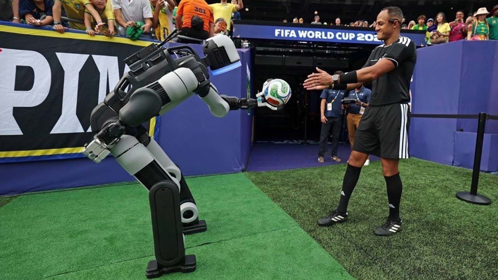 Atlas delivers the ceremonial match ball to the referee.