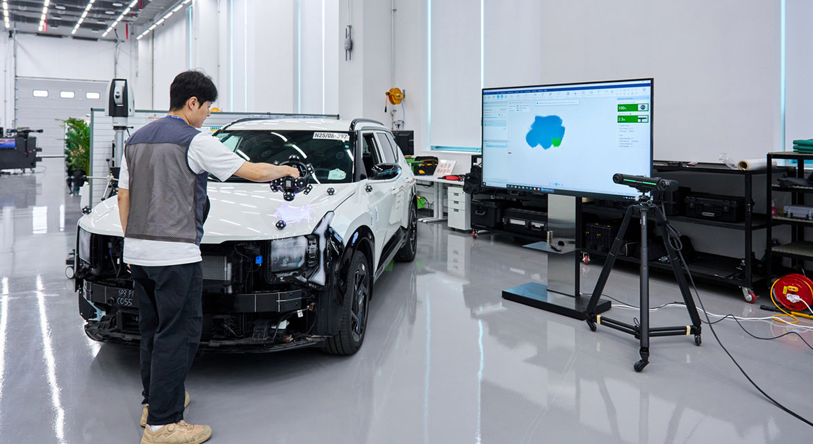 Engineers use a portable 3D scanner to verify assembly quality, helping ensure components fit and function as intended before final vehicle assembly.