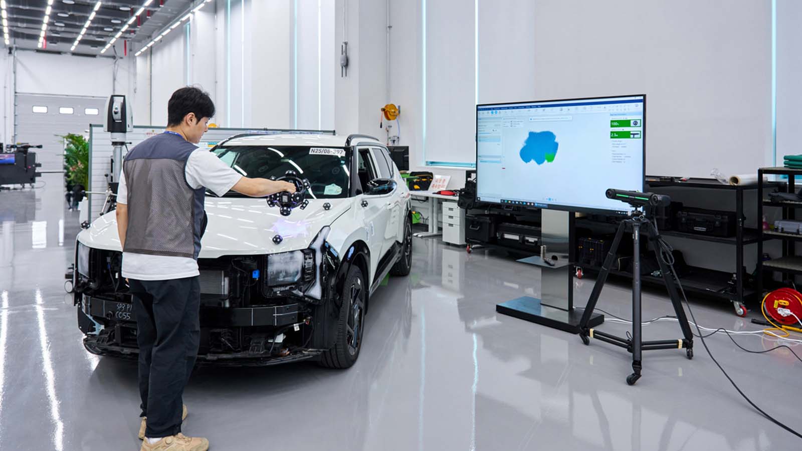 Engineers use a portable 3D scanner to verify assembly quality, helping ensure components fit and function as intended before final vehicle assembly.