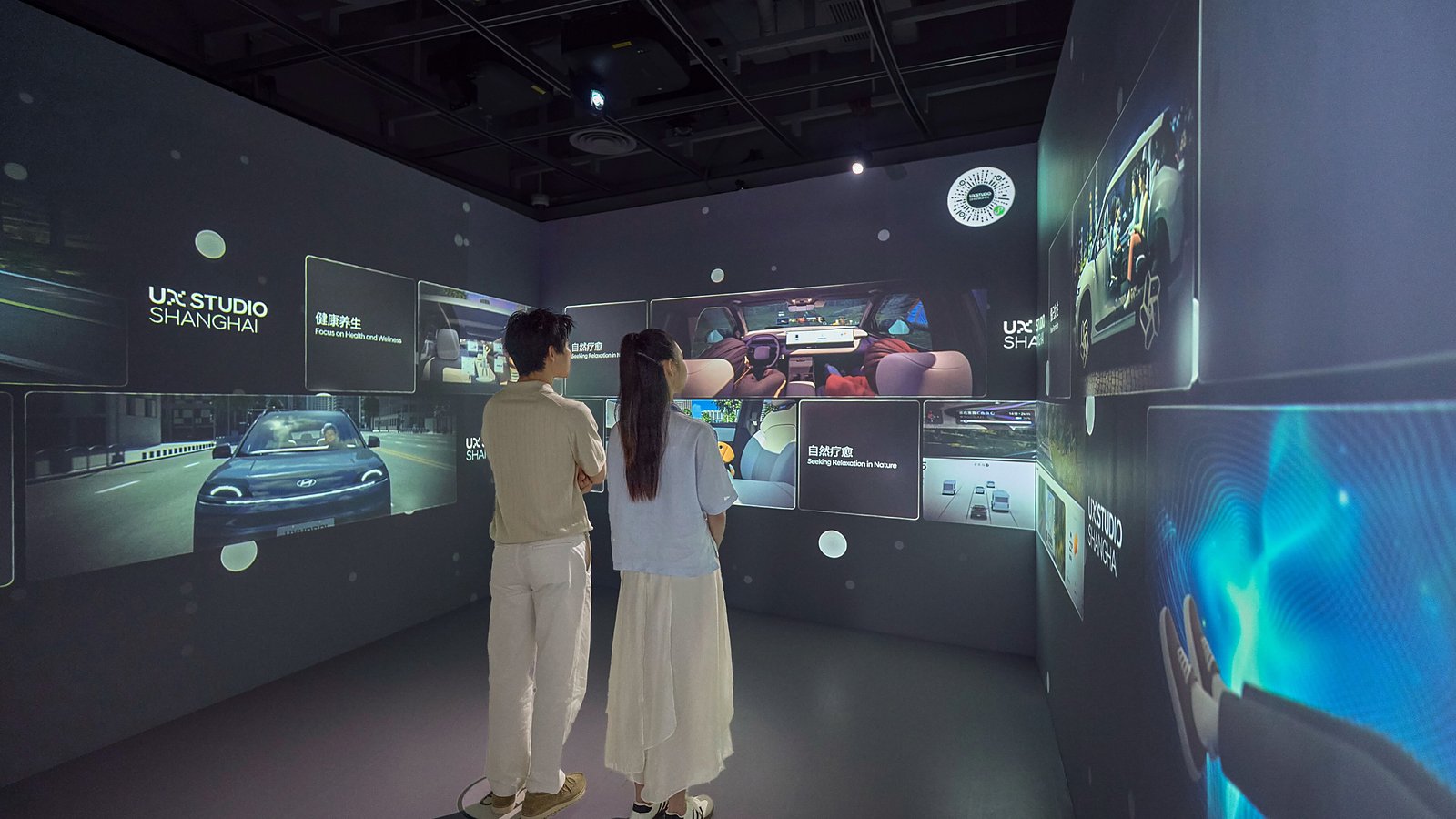Visitors experience immersive video content at the UX Vision Room in the UX Explorer Zone, showcasing future mobility usage trends identified through extensive user experience research.
