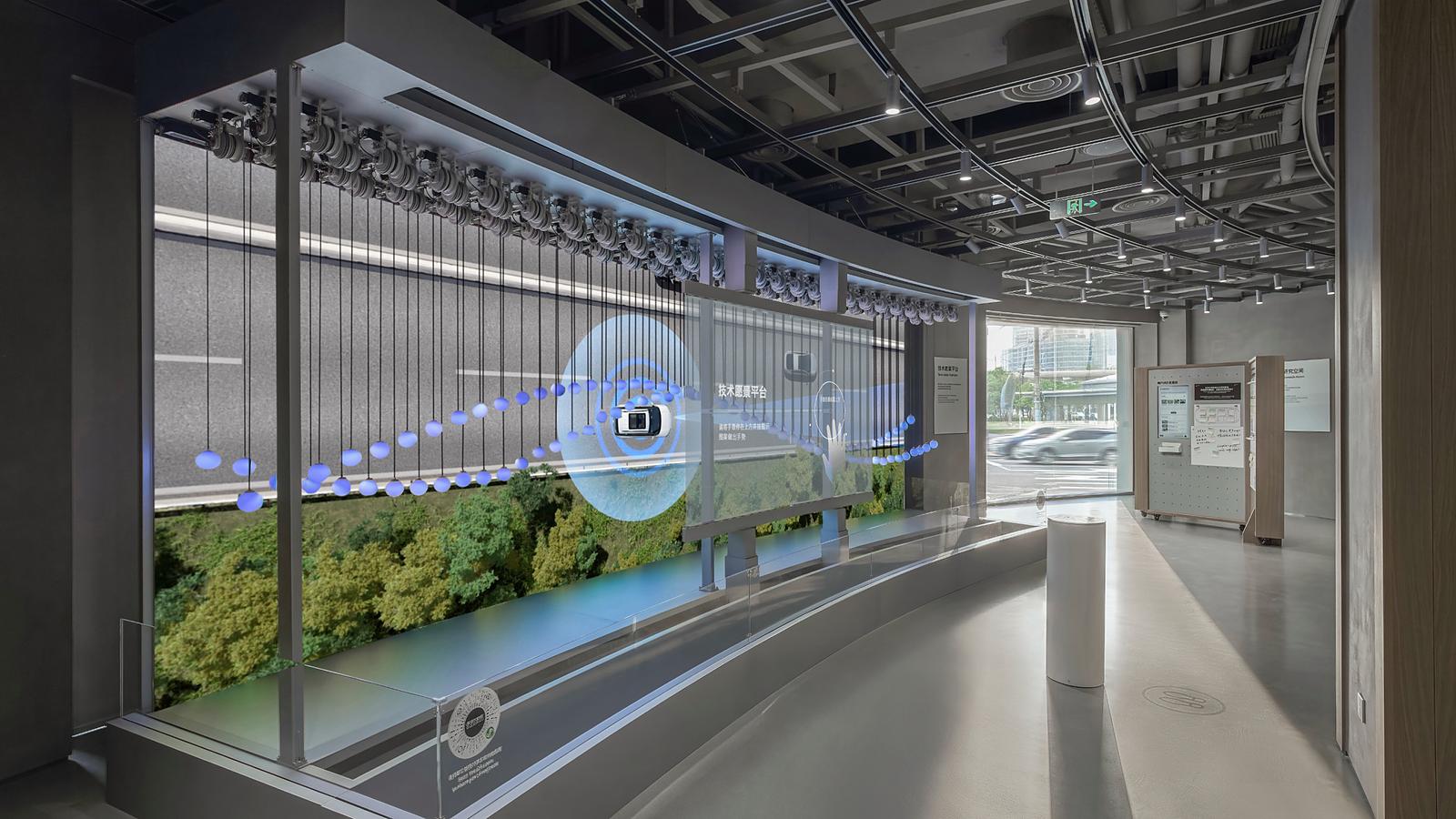 The UX Explorer Zone features a tech-vision platform with transparent LED displays and kinetic installations, demonstrating Hyundai Motor Group's vision for the future of mobility.